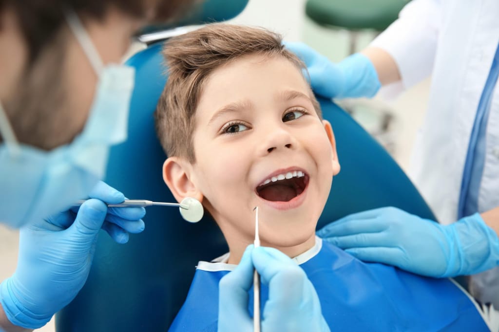 лечить зубы детям